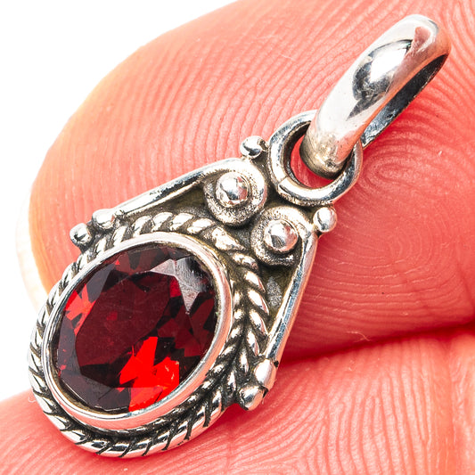 Garnet pendant charm in .925 sterling silver with oval red gemstone and ornate bezel