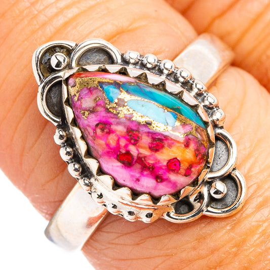 Close-up oval magenta and turquoise gemstone on sterling silver ring, size 7.75