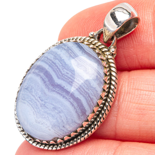 Oval blue lace agate pendant in sterling silver bezel with braided rope edge and bail