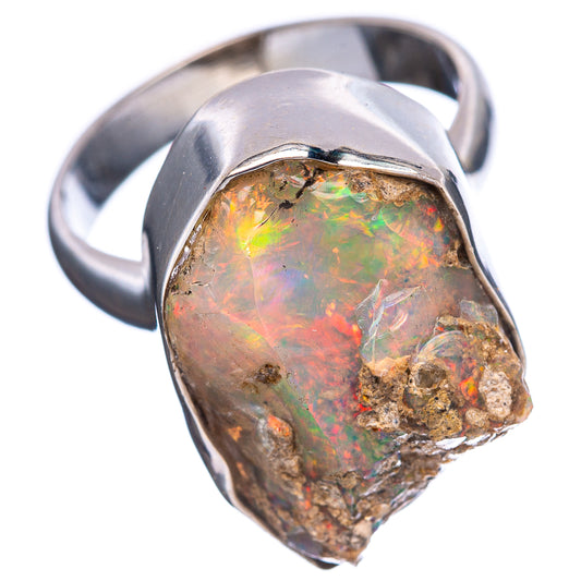 Sterling silver ring with faceted raw opal, colorful rainbow flashes over golden-brown matrix