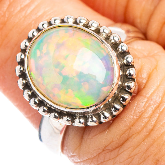Sterling silver opal ring with oval Ethiopian opal and beaded halo bezel
