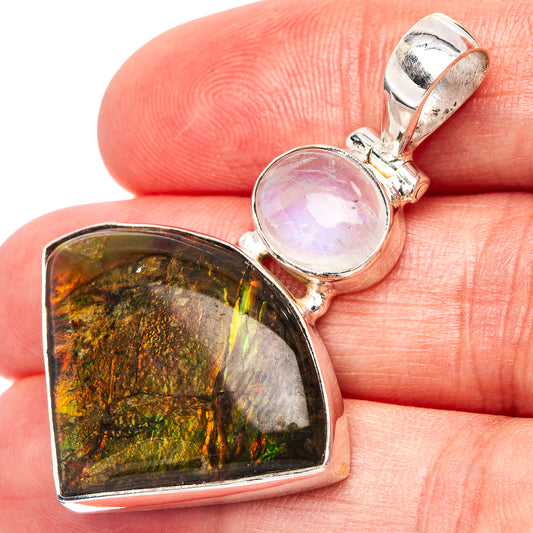 Sterling silver pendant with oval rainbow ammolite and round pale moonstone cabochon