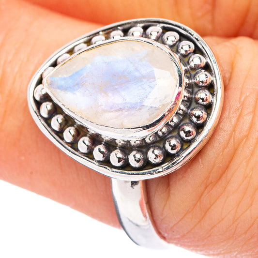 Oval moonstone ring in .925 sterling silver with faceted bezel and bead detail