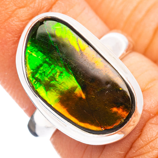 Sterling silver ammolite ring with oval green-orange iridescent stone in bezel setting