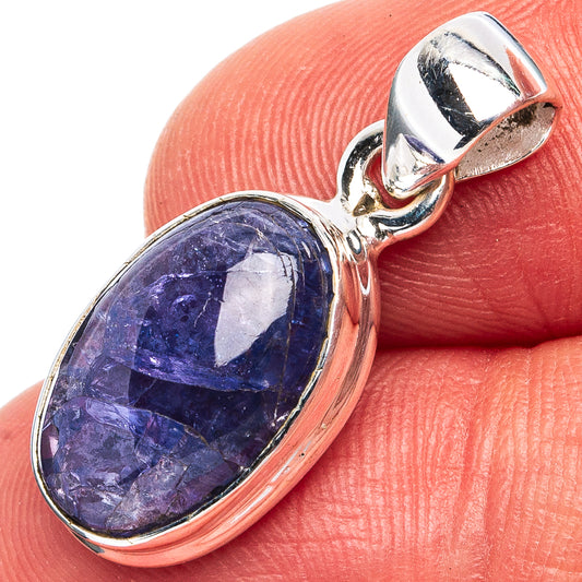 Oval blue tanzanite pendant close-up with .925 sterling silver bail and bezel
