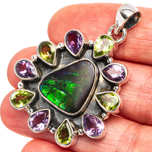 Heart-shaped ammolite pendant in sterling silver with purple and green gemstone accents