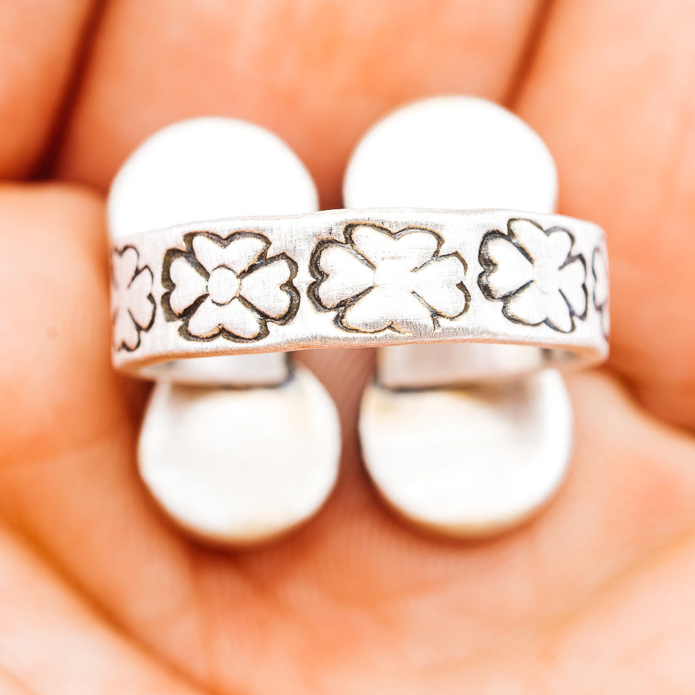 Floral engraved silver band with scalloped edges and yellow cabochon ring top