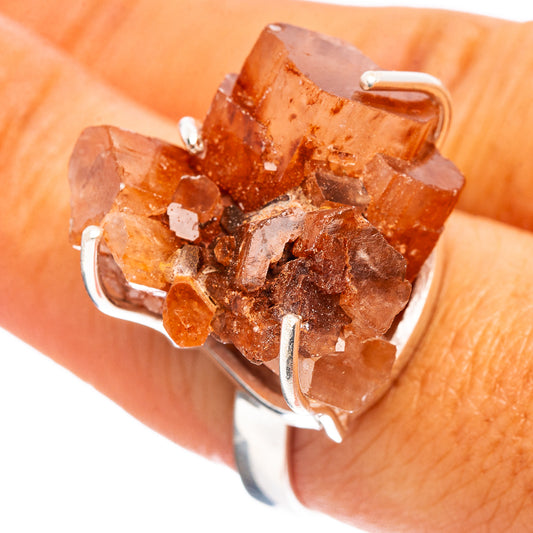 Raw orange aragonite ring with .925 sterling silver prongs, ring size 8.25