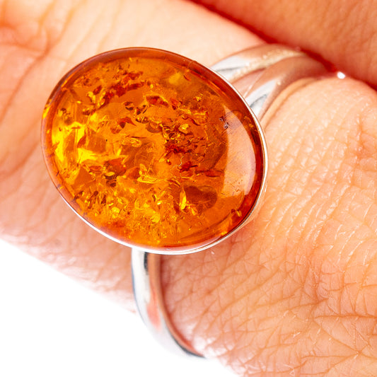 Amber cabochon ring in .925 sterling silver, warm orange translucent stone