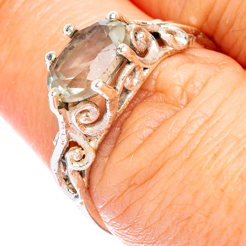 Sterling silver dainty ring with faceted green amethyst and ornate prongs