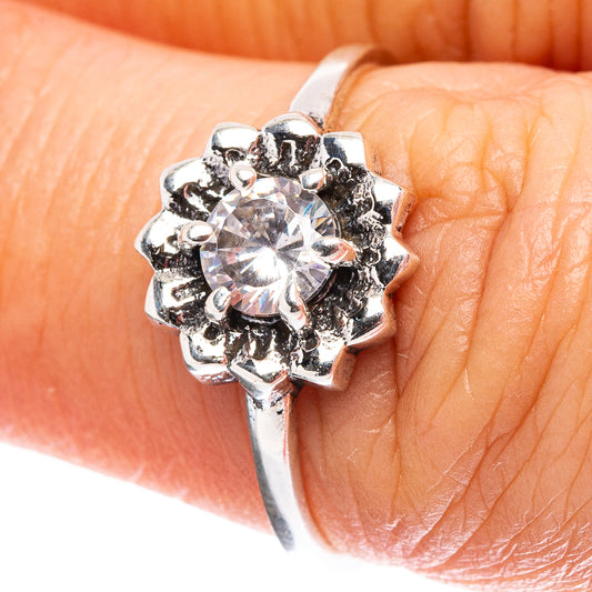 Sterling silver ring with round cubic zirconia center and blackened prong accents