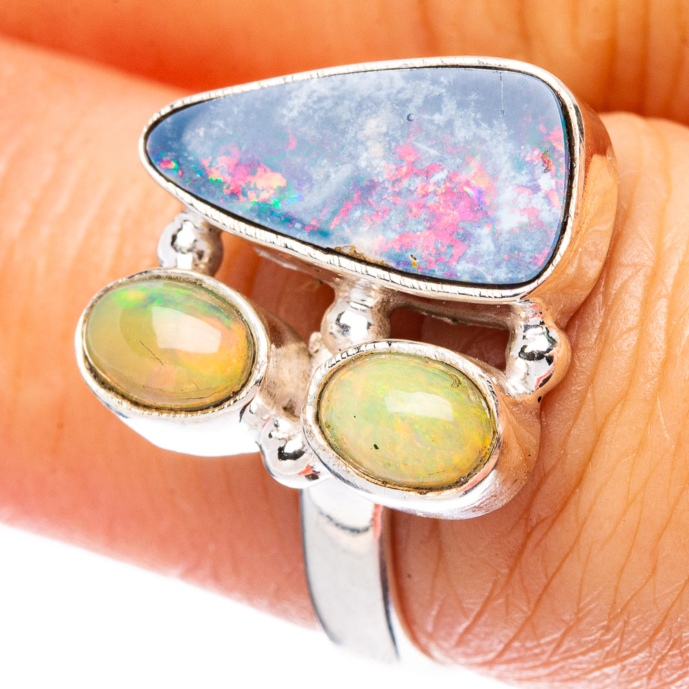 Sterling silver opal ring with blue oval center and two green oval side stones