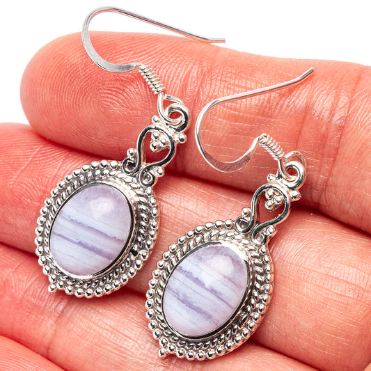 Sterling silver drop earrings with round purple lace agate cabochons and bead border