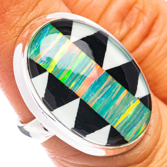 Sterling silver oval ring with vibrant green, orange and blue opal-style inlay