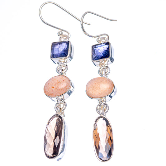 Sterling silver drop earrings with blue square, peach round, and faceted oval dark stones