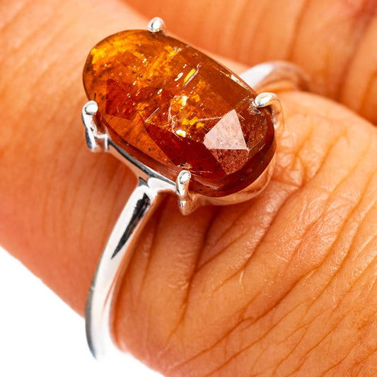Orange kyanite oval ring with four silver prongs, size 6.75
