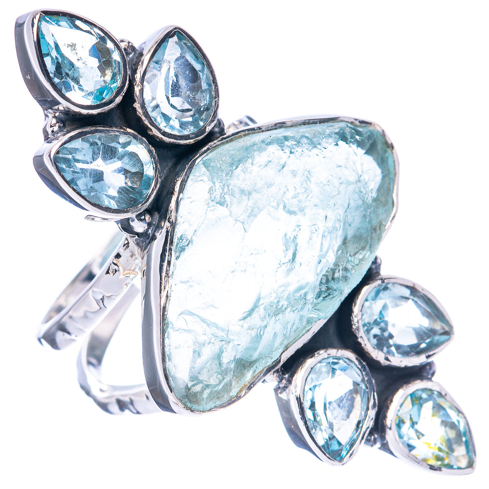 Sterling silver statement ring with rough aquamarine center and blue topaz bezel stones