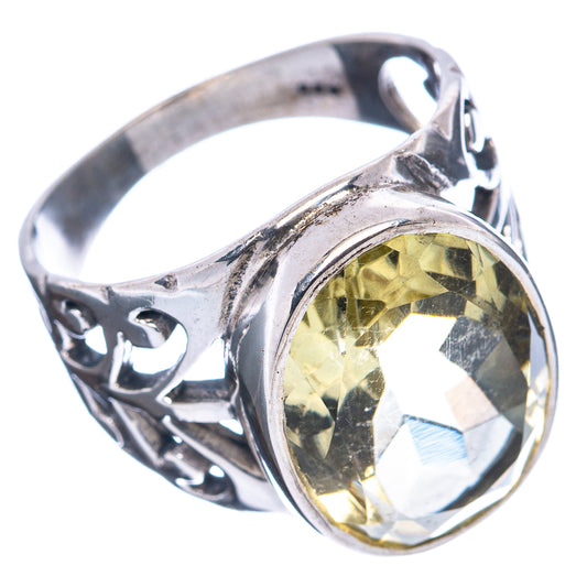 Sterling silver ring with oval lemon quartz, swirling bezel and decorative side cutouts