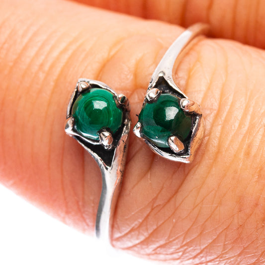 Sterling silver malachite ring, size 8, close-up of two green round gemstone settings