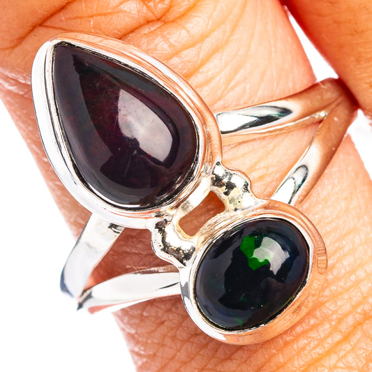 Sterling silver oval opal ring with large dark cabochon and smaller green opal accents