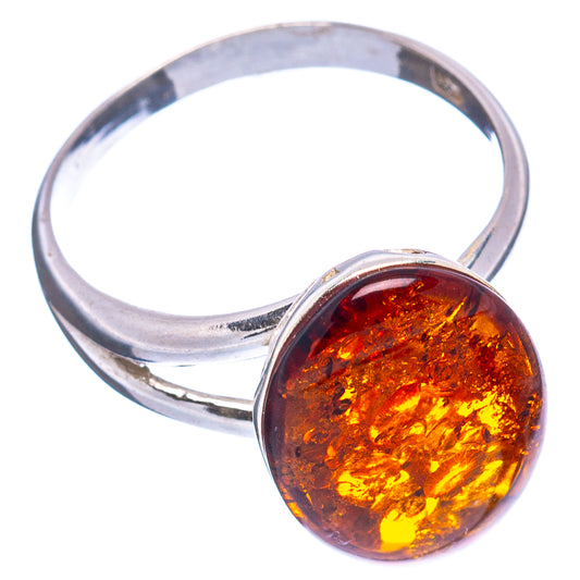 Sterling silver amber ring with round cognac cabochon stone, angled view