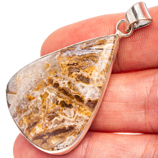 Silver-plated teardrop agate pendant with lace-like brown and cream pattern