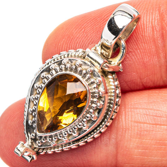 Citrine poison pendant in .925 sterling silver with ornate oval bezel and faceted gem