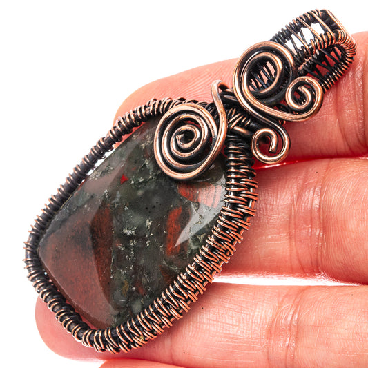 Oxidized copper wire-wrap pendant with teardrop bloodstone cabochon and spiral details