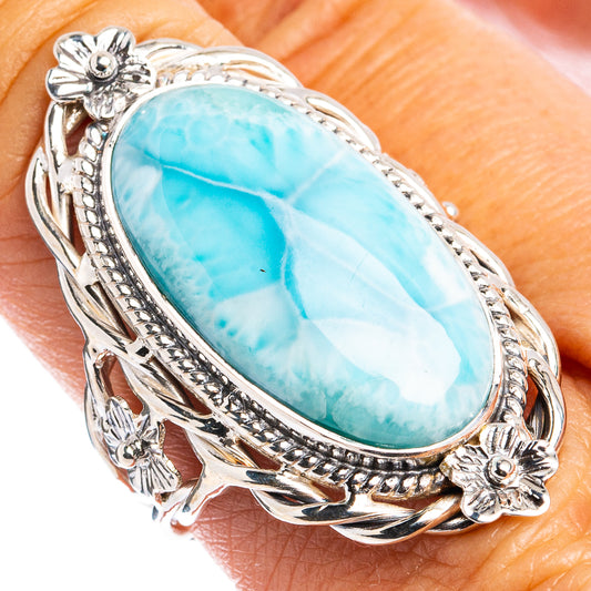 Oval larimar stone sterling silver ring with ornate floral bezel and rope details