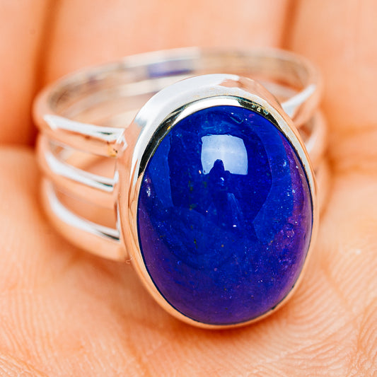 Sterling silver tanzanite ring with large oval blue cabochon on hand