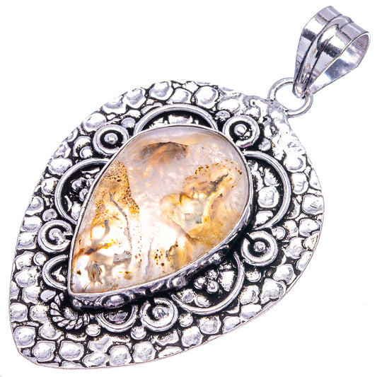 Teardrop Montana agate pendant in silver-tone ornate setting with hanging bail