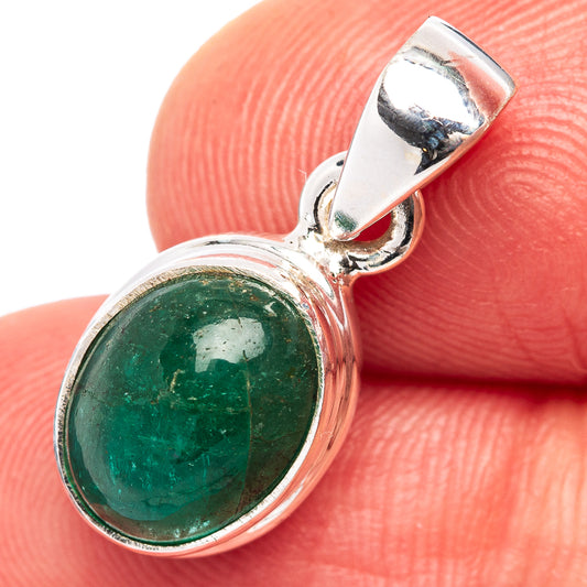 Sterling silver emerald pendant close-up with green cabochon and open back bail