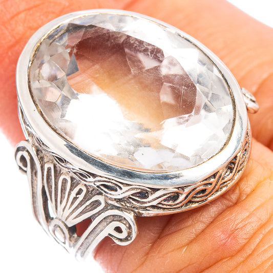 Sterling silver oval quartz ring with clear gemstone and ornate scroll design