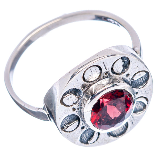 Sterling silver ring with round red garnet, scalloped prong setting and engraved band