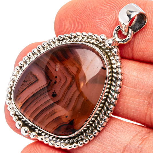 Sterling silver Montana agate pendant with dark brown-red oval stone and bail