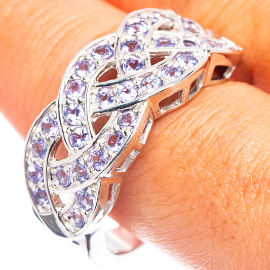 Sterling silver tanzanite-style ring with faceted purple stones, openwork design