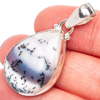 Sterling silver teardrop pendant with dendritic opal, blue-white stone and dark vein detail.