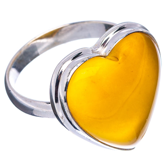 Heart-shaped amber cabochon ring with bright silver bezel, side view, size 9.25