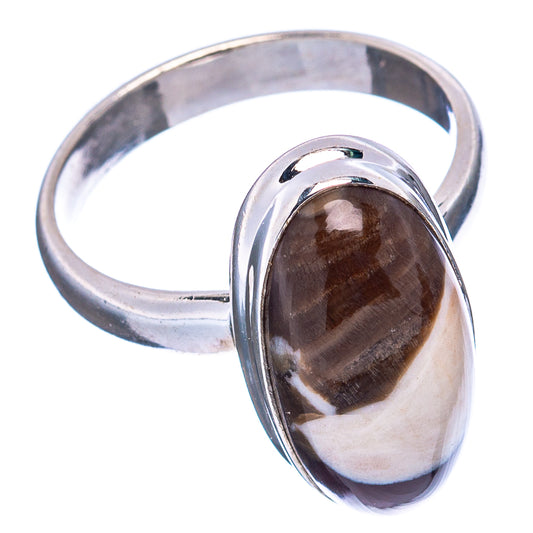Sterling silver oval jasper ring with reflective bezel, dark black-brown stone