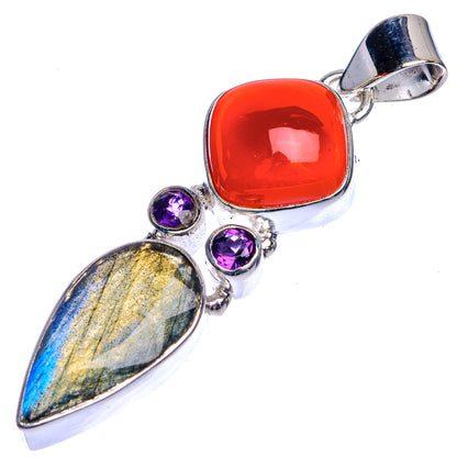 Sterling silver gemstone pendant: red cabochon, purple stones, labradorite blue-gold center