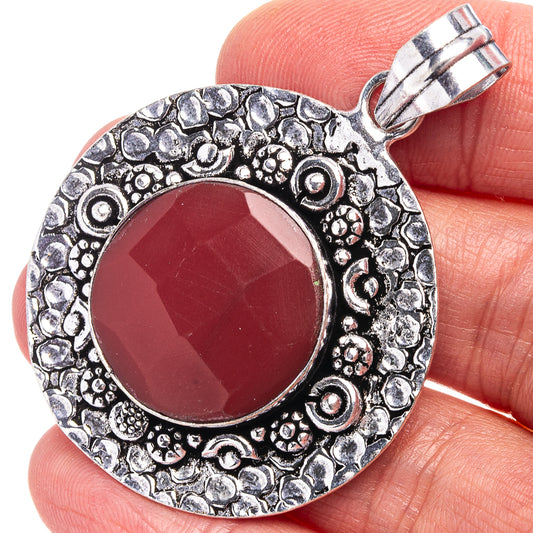 Red onyx round pendant with German silver filigree border and hanging bail