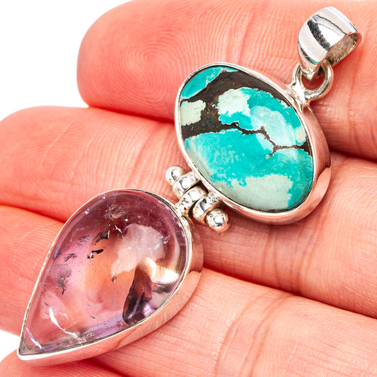 Turquoise oval cabochon pendant in sterling silver with partial teardrop stone