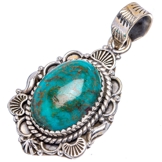 Turquoise oval cabochon pendant with .925 sterling silver filigree frame and bail