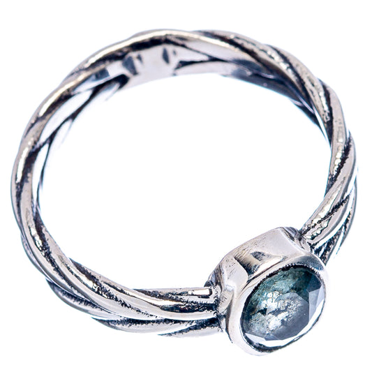 Sterling silver ring with oval aquamarine bezel and swirling twisted shank