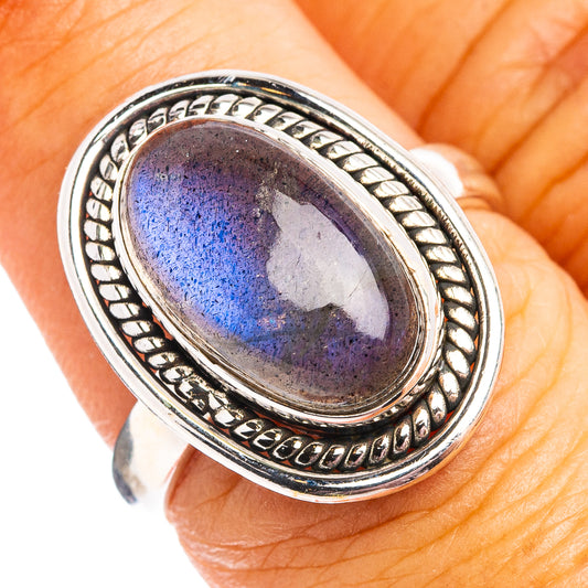 Oval labradorite ring in .925 sterling silver with blue/gray gemstone bezel setting