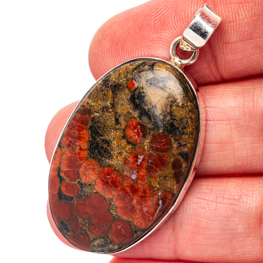 Sterling silver pendant with oval red, gold and black stone, top bail loop