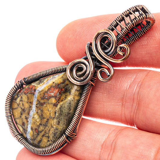 Oxidized copper wire-wrapped teardrop pendant with dark stone cabochon