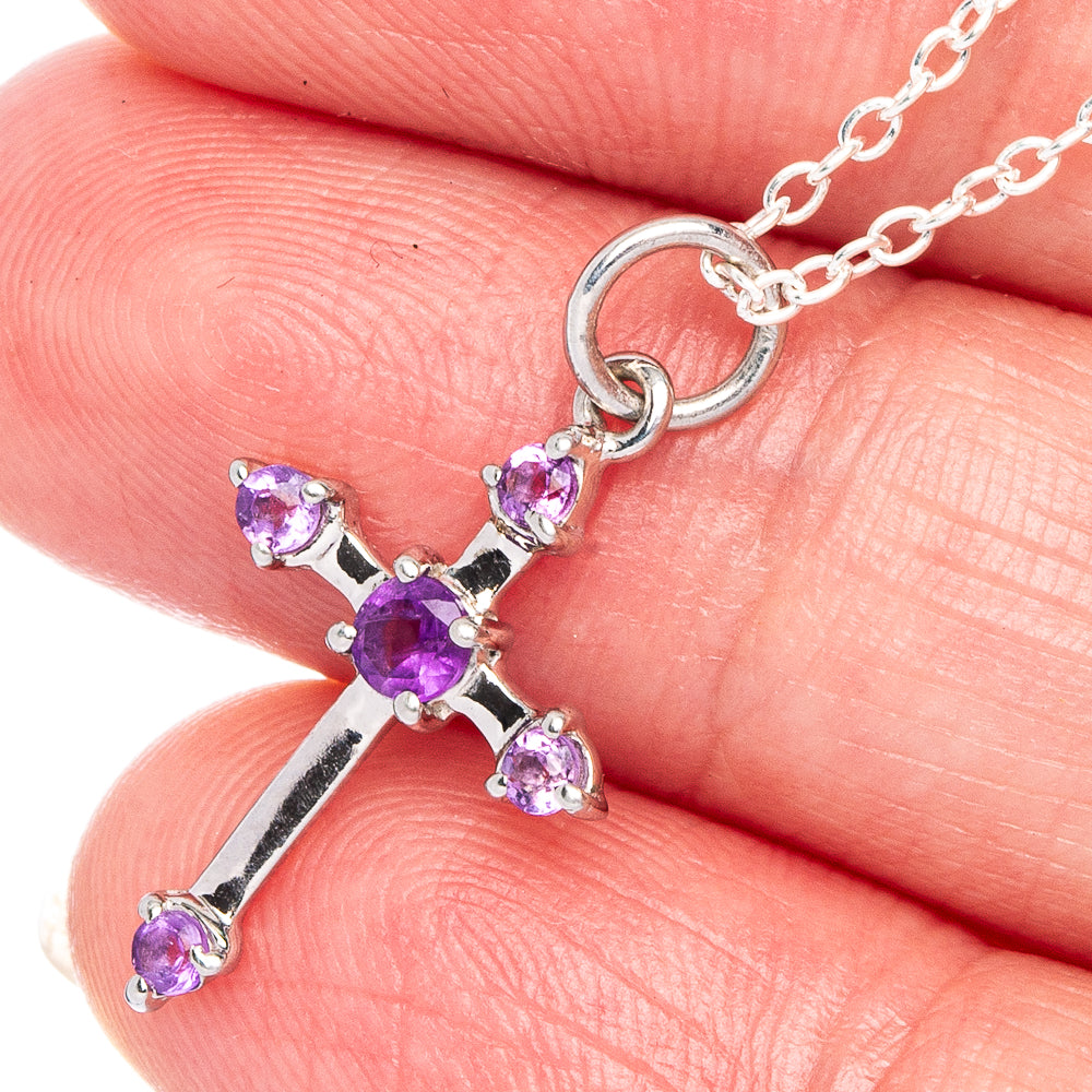 Sterling silver cross pendant with faceted purple amethyst stones on link chain