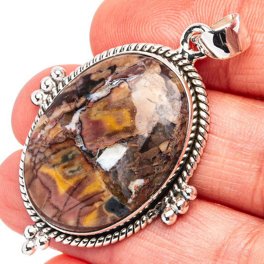 Sterling silver butterfly jasper oval pendant with detailed bezel and bail, close-up