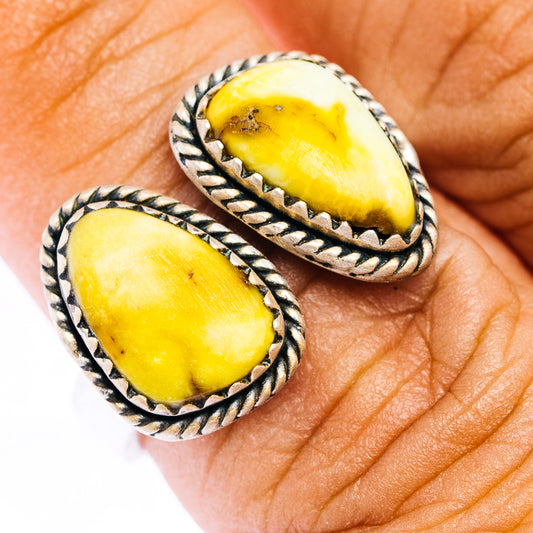 Sterling silver oval gemstone ring with braided bezel, yellow stone, adjustable band